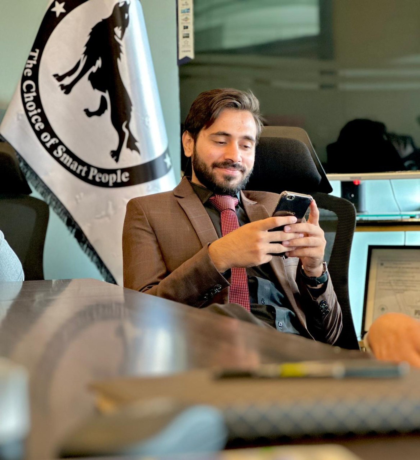 Muhammad Usman Ghouri working in a professional environment